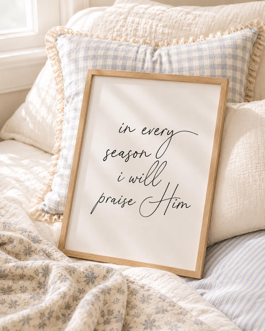 In Every Season I Will Praise You English Christian art print with black script lettering in a light wooden frame